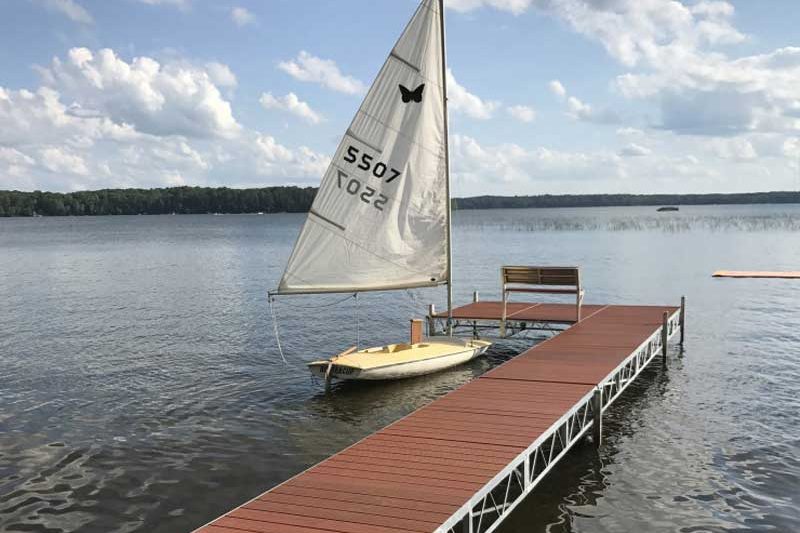 sail boat next to jack down on lake